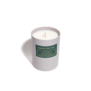 Candle in a gray container with a green label on a white background
