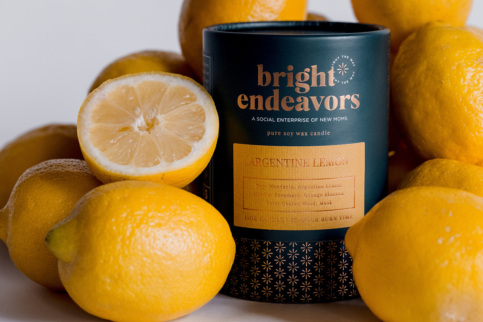 Argentine Lemon Bright Endeavors Pure Soy Wax Candle Surrounded By Lemons